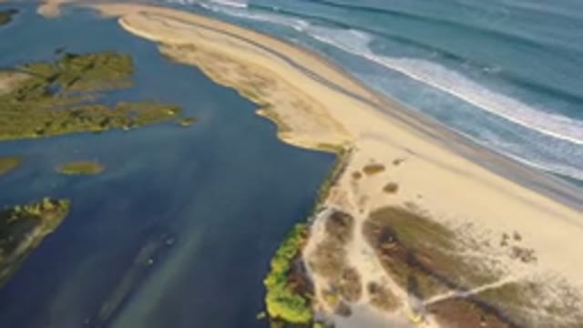 LOS CABOS MEXICO-2020: Brightly Lit Ocean Beach With Small Rolling Waves And