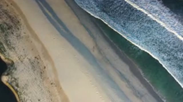 LOS CABOS MEXICO-2020: Aerial View Of Green Ocean And Waves With Gold Sand