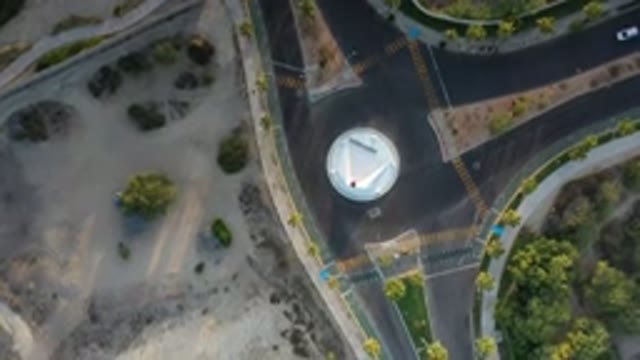 LOS CABOS MEXICO-2020: People Driving Cars in Road Using a Roundabout with Trees