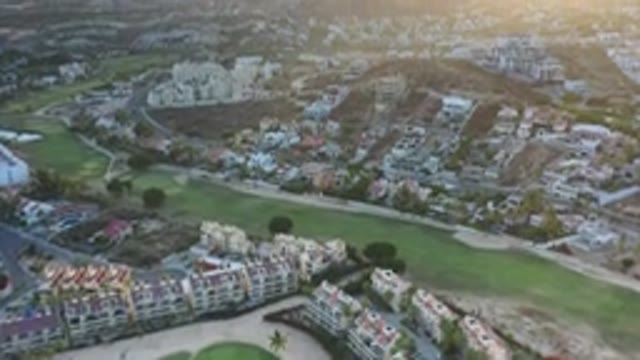 LOS CABOS MEXICO-2020: City Suburbs With Green Grassy Area And Homes During Sunrise