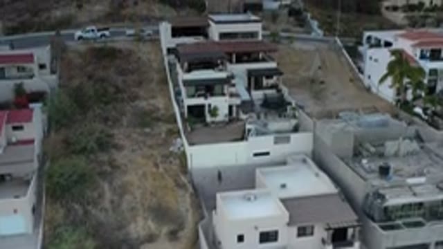 LOS CABOS MEXICO-2020: Scenic Drive Past Houses, Trees, and Road