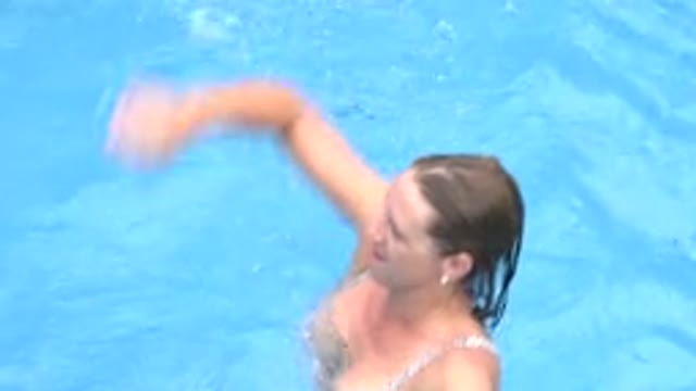 LOS CABOS MEXICO-2020: Woman In Swimming Pool Waving Her Arms As If In An