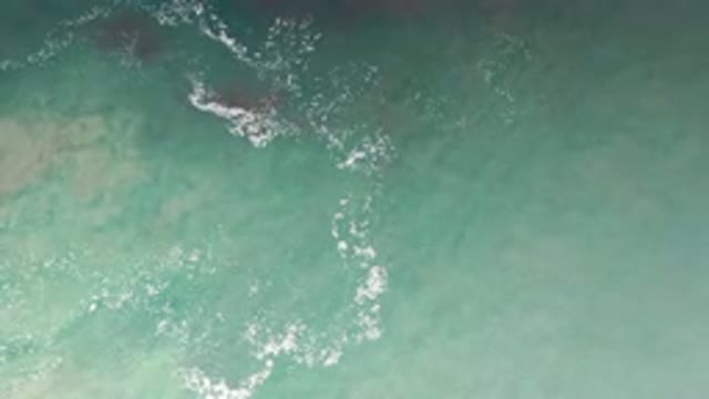 LOS CABOS MEXICO-2020: Overhead View Of The Gorgeous Waving Red And Blue Sea