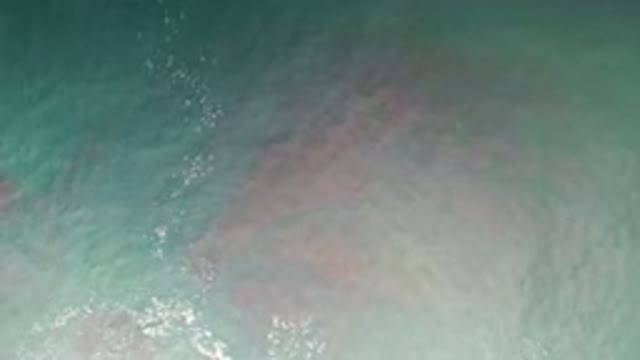 LOS CABOS MEXICO-2020: Beautiful Blue Green Ocean Flowing With Pink And Red