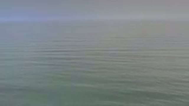 LOS CABOS MEXICO-2020: Blue Gray Flowing Ocean Water With Cloudy Skies Above