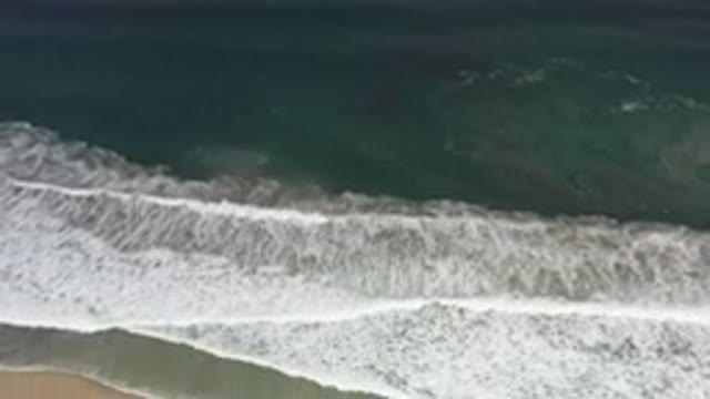 LOS CABOS MEXICO-2020: Strong And Wide White Bubbled Waves Over The Sand Beach