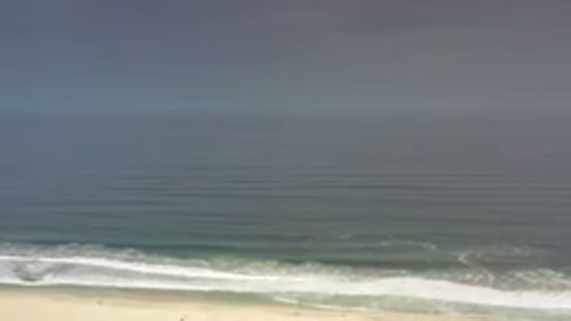 LOS CABOS MEXICO-2020: White And Blue Rolling Foam Waves Crashing On The Beach