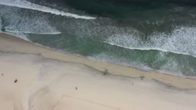 LOS CABOS MEXICO-2020: Aerial View Of The Ocean Blue Waters And Soft Waves