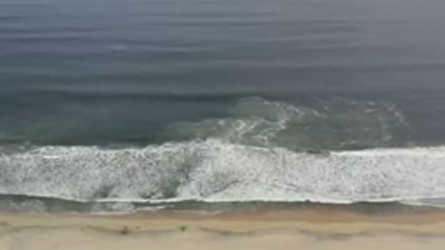 LOS CABOS MEXICO-2020: Waves Coming On To The Beach As The Camera Zooms In