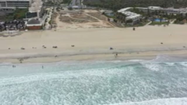 LOS CABOS MEXICO-2020: The Clear And Transparent Sea Going Towards The Sand On
