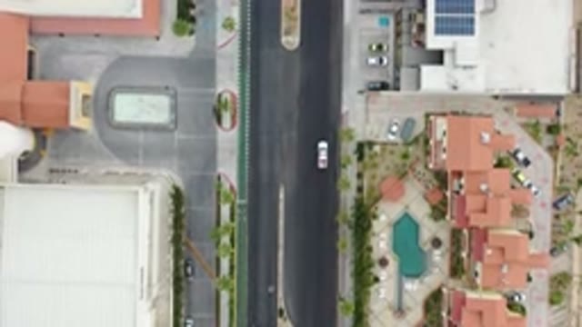 LOS CABOS MEXICO-2020: A Car Driving Down The Street In A Residential Area