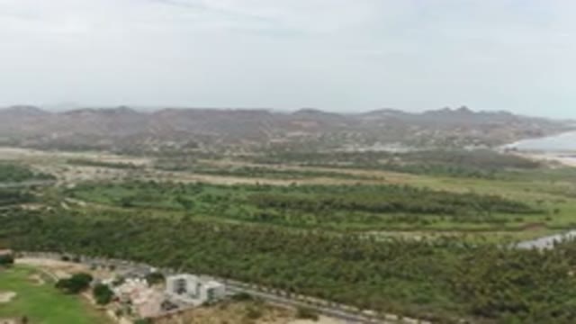 LOS CABOS MEXICO-2020: Aerial View Of A Big Green Land With The Ocean In The