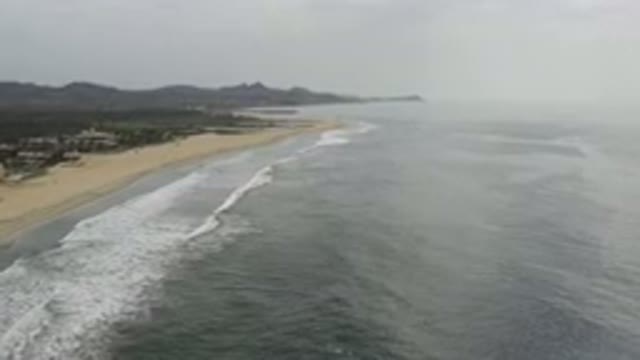 LOS CABOS MEXICO-2020: Camera Zooms In On A Beach With Foam