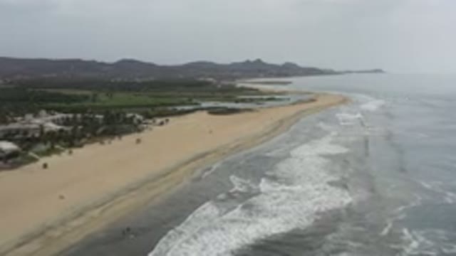 LOS CABOS MEXICO-2020: Beautiful Sandy Secluded Beach With Lush Green Mountains
