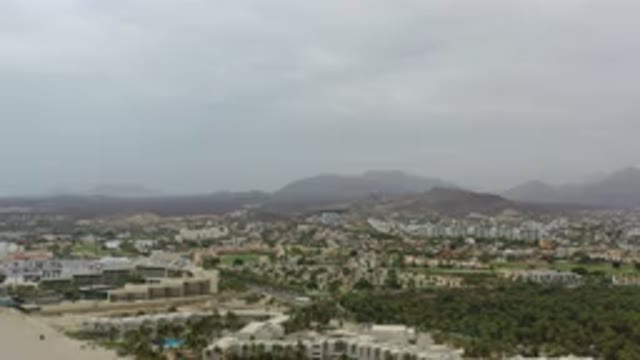 LOS CABOS MEXICO-2020: A Camera Shows A Town From Above With Hills In The Background