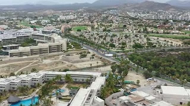 LOS CABOS MEXICO-2020: Aerial View Of Luxury Apartments Next To Highway And Hills