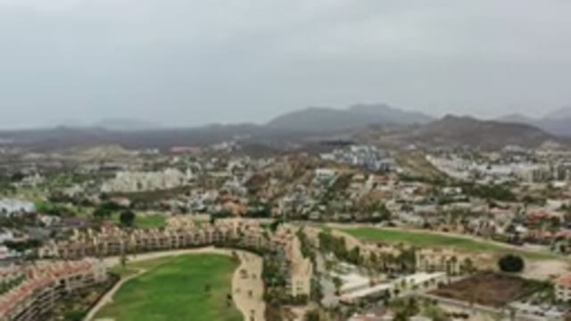 LOS CABOS MEXICO-2020: Top View Of A City Showing Houses Mountains Roads