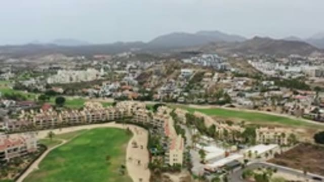 LOS CABOS MEXICO-2020: A Town Seen From Above With Hills In The Background