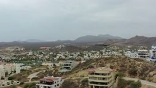 LOS CABOS MEXICO-2020: Sandy Beach Landscape With Trees And Condos