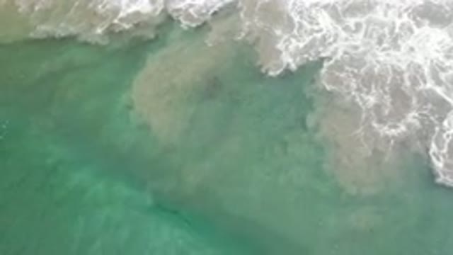 LOS CABOS MEXICO-2020: Aqua Colored Blue Waves Crashing Onto The Shore