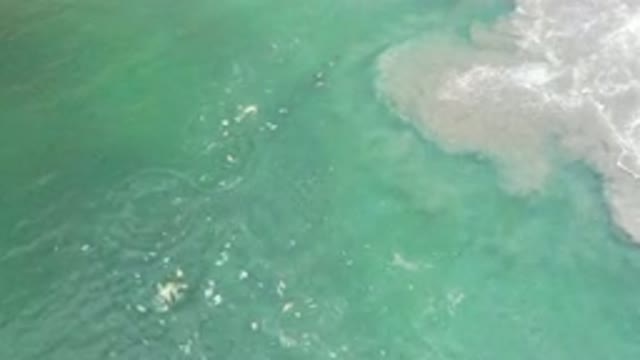 LOS CABOS MEXICO-2020: Waves Crashing Into The Sand Bar Of The Blue Ocean