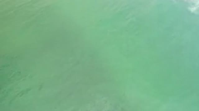 LOS CABOS MEXICO-2020: Overhead View Of Calm Green Sea Water Moving Slowly With
