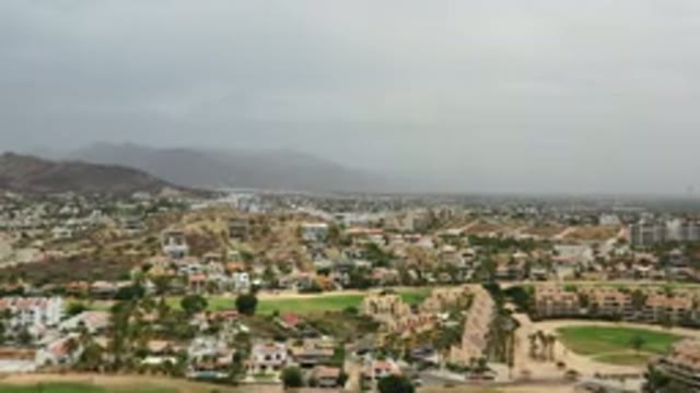 LOS CABOS MEXICO-2020: Aerial View Of City With Buildings And Cloudy Sky In