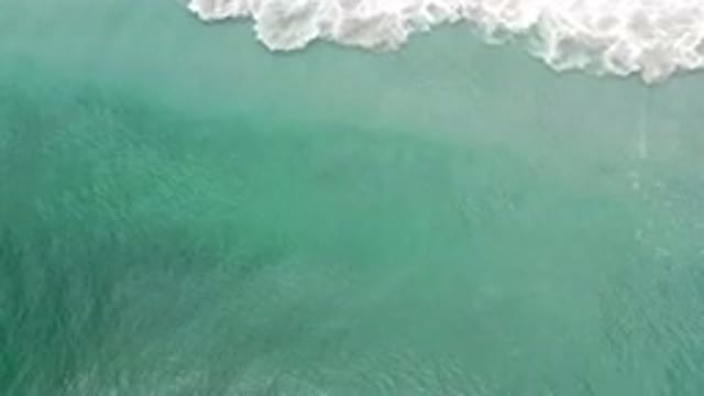 LOS CABOS MEXICO-2020: Camera Zooms In On Murky Water That Is Splashing On Land