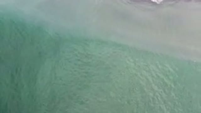 LOS CABOS MEXICO-2020: Blue Green Waves Crash Against Beach And Mix With Sand