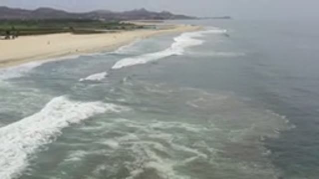 LOS CABOS MEXICO-2020: Aerial View Of An Island Beach Toward The Mountain Range