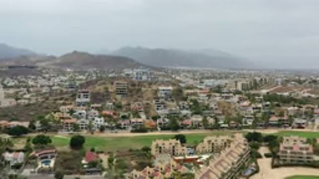 LOS CABOS MEXICO-2020: Drone Flies Towards Hillside Town