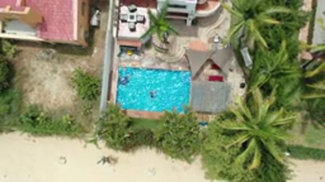 LOS CABOS MEXICO-2020: Top View Of Swimming Pool With Clear Blue Water And Trees
