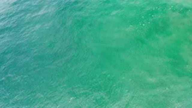 LOS CABOS MEXICO-2020: Aerial View Of Green Tropical Water Gently Blown Around