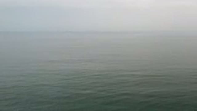 LOS CABOS MEXICO-2020: Calm Gray Ocean Water With Fog in the Distance
