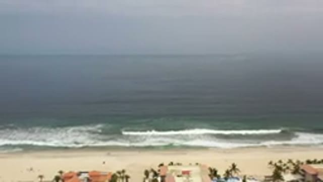 LOS CABOS MEXICO-2020: Cloudy Day As Waves Crash Onto Shore Near Homes