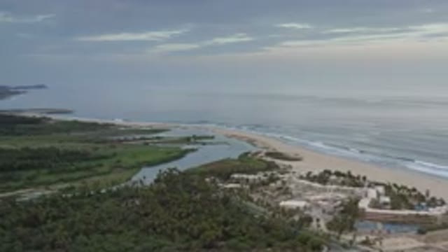 LOS CABOS MEXICO-2020: A View Of A Coast With A Small Town On The Side And A