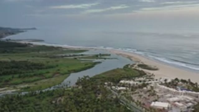 LOS CABOS MEXICO-2020: The View Of A River Joining The Ocean Shot From Drone