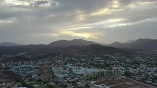 LOS CABOS MEXICO-2020: Beautiful Cloudy Sky Amazing Mountains Town View Drone