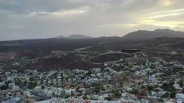 LOS CABOS MEXICO-2020: A Beautiful Sky And Far Top View Of A Town With White Buildings