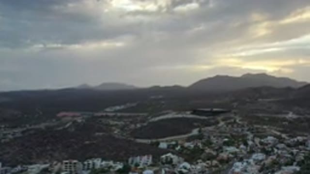 LOS CABOS MEXICO-2020: Beautiful Footage Of A City Next To Mountains With Clouds
