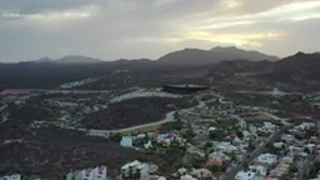 LOS CABOS MEXICO-2020: Flyover Small Town With Large Building In The Center