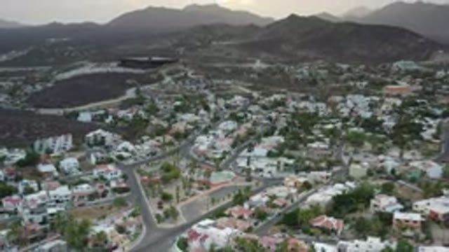 LOS CABOS MEXICO-2020: Drone View Of A Residential Area With Streets Houses And Mountains