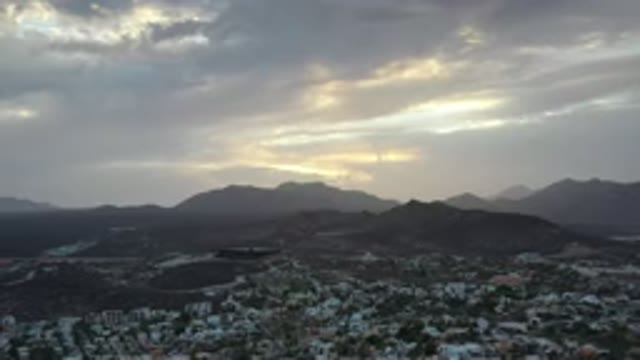 LOS CABOS MEXICO-2020: The Sun Rising After Night Time Behind Multiple Dark