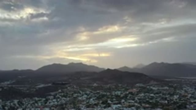 LOS CABOS MEXICO-2020: Flyover View Of Sky And Valley City Area Mountains And