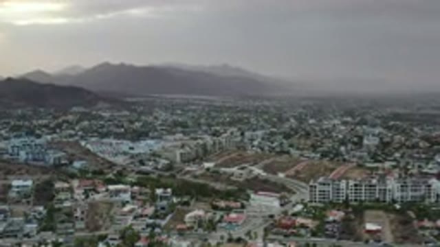 LOS CABOS MEXICO-2020: View Of A Large Suburban City Panning Out From A Cloudy