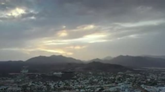 LOS CABOS MEXICO-2020: Sunlight Peers Through Breaks In Gray And White Clouds