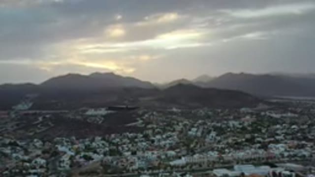 LOS CABOS MEXICO-2020: Overhead View Of City With Mountains In The Background At Dusk