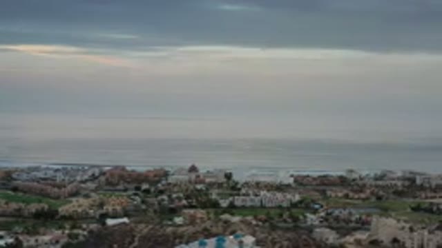 LOS CABOS MEXICO-2020: A Group Of Buildings Sitting Around A Lake Or A Body Of Water