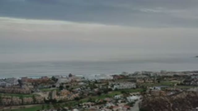 LOS CABOS MEXICO-2020: Panning Shot Of Residential Area Overlooking Large Water