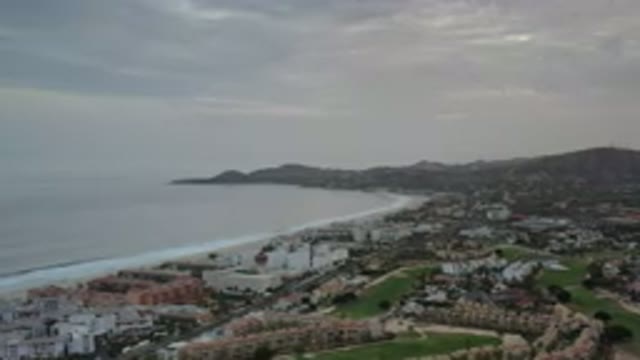 LOS CABOS MEXICO-2020: Overcast Hilly Coastline And City With Roads And Green